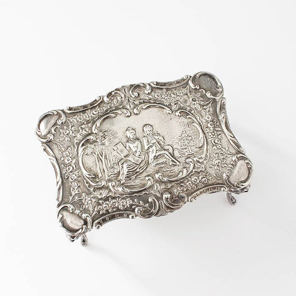 a beautiful sterling silver miniature dolls house table with an engraved scene dated and hallmarked london 1901