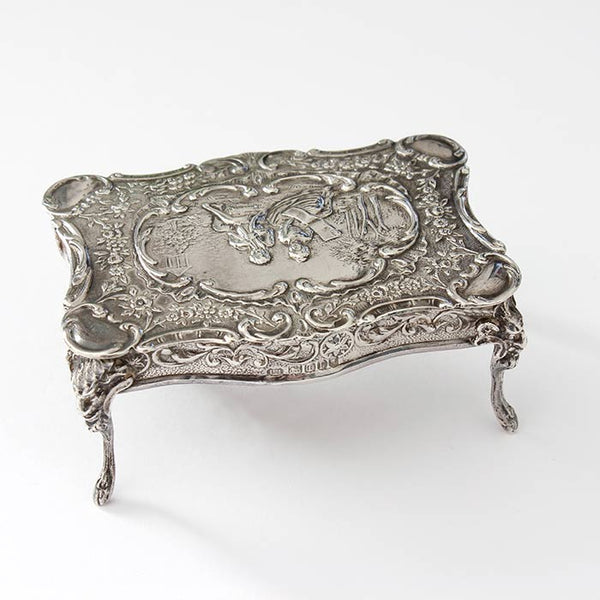 a beautiful sterling silver miniature dolls house table with an engraved scene dated and hallmarked london 1901