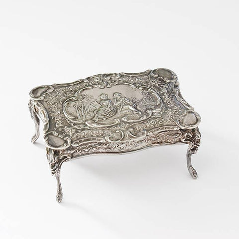 a beautiful sterling silver miniature dolls house table with an engraved scene dated and hallmarked london 1901