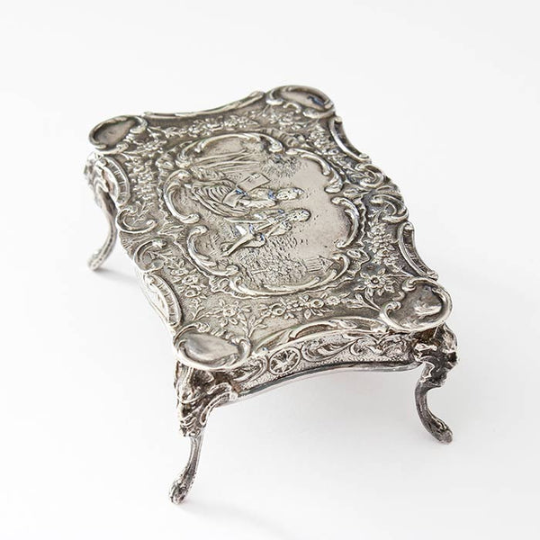 a beautiful sterling silver miniature dolls house table with an engraved scene dated and hallmarked london 1901