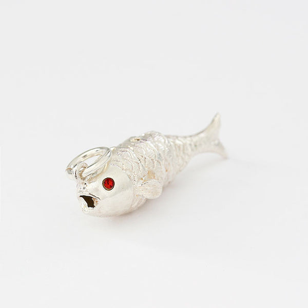 sterling silver moving fish charm with red stone eyes