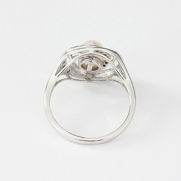 modern ladies pearl and diamond ring in white gold
