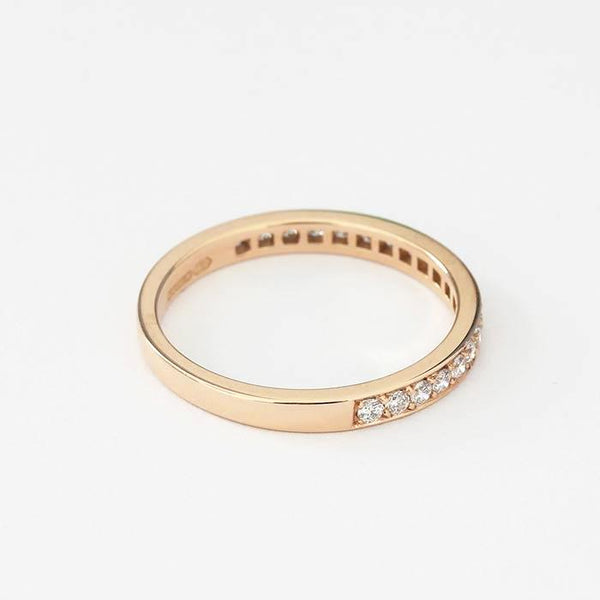 an 18ct rose gold diamond eternity ring with a 2mm band and 20 small round diamonds