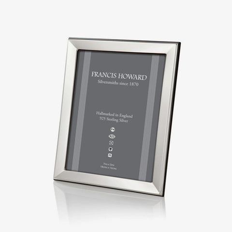 silver photo frame made in sheffield with a bevelled edge and wooden black finish