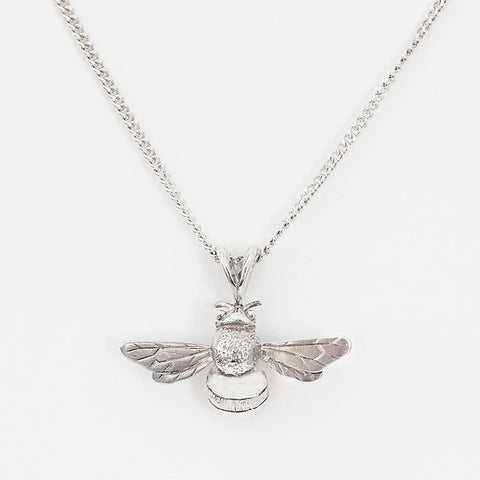 silver bee pendant with a curb link necklace