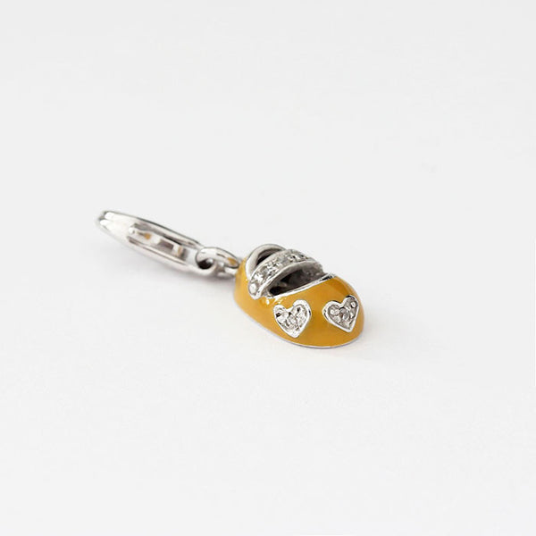 silver enamel baby shoe charm with yellow and stones