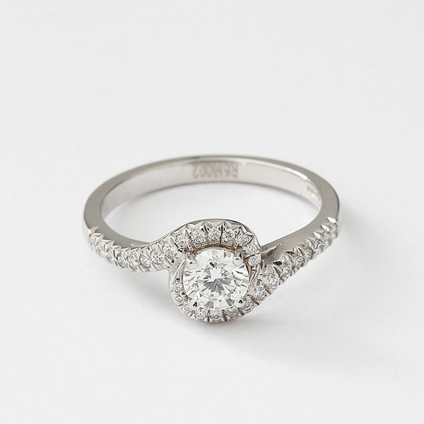 diamond crossover engagement ring in platinum with diamond shoulders