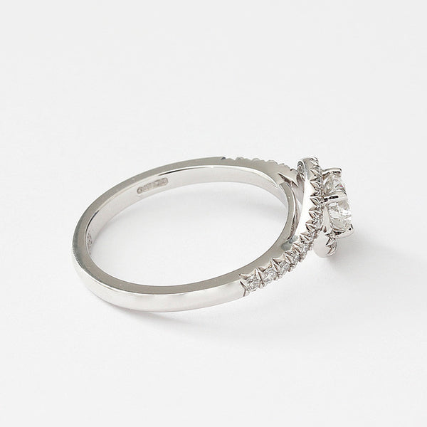 diamond crossover ring in platinum with diamond shoulders and claw setting