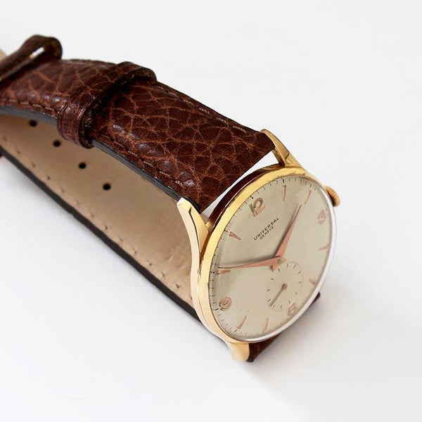 a secondhand preowned universal gents watch with 18ct rose gold case and brown leather strap with 33mm dial