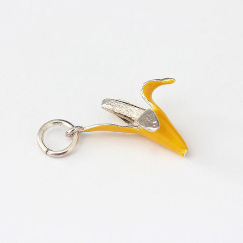 silver banana charm with yellow enamel